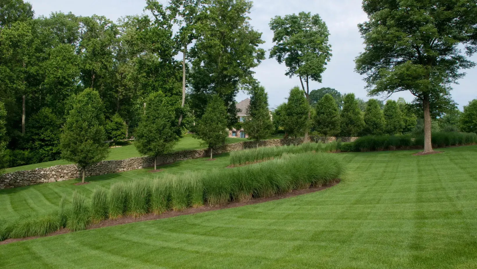 chestnut hill estate designed by terren landscapes with ornamental grasses