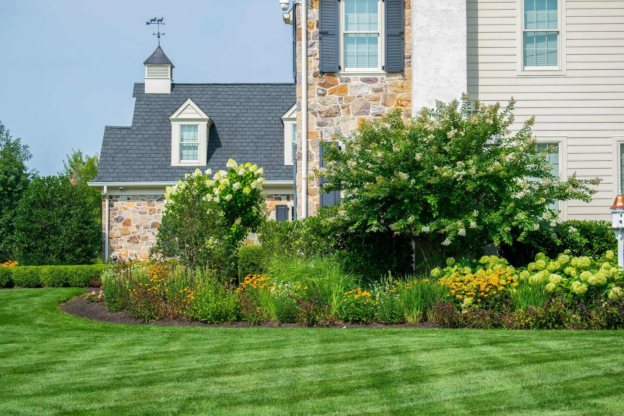 Green Striped Lawn with Pollinator Garden